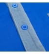 Thumbnail Close-up of blue polo placket with chambray trim.