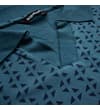 Thumbnail Close-up of open collar on petrol geometric print polo.