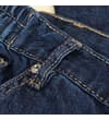 Thumbnail Close-up of belt loop and waistband on dark wash jeans.