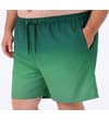 Thumbnail Model wearing dark green ombre swim shorts, angled front view.
