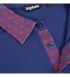 Thumbnail Close-up of polo placket and collar with red pattern.