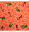 Thumbnail Close-up of pineapple and sunglasses print on orange shorts.