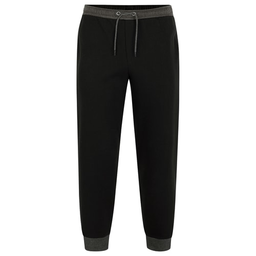 Black joggers with charcoal waistband and cuffed hems, front view.