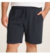 Thumbnail Charcoal waffle lounge shorts worn with hand in pocket.