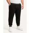 Thumbnail Black joggers worn with charcoal waistband, cuffs and side pockets.