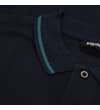 Thumbnail Close-up of navy polo collar with green tipping and placket.