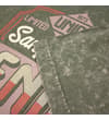 Thumbnail Close-up of sleeve hem and front graphic on olive T-shirt.