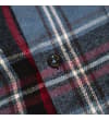 Thumbnail Close-up of front button detail on blue checked flannel.