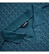 Thumbnail Close-up of collar and neckline on petrol geometric polo.