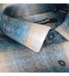 Thumbnail Close-up of collar and top buttons on turquoise check overshirt.