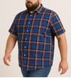Thumbnail Model wearing blue short sleeve check shirt, angled view.