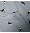 Thumbnail Close-up of crew neck and toucan print on light blue fabric.