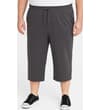 Thumbnail Model wearing charcoal cropped sweatpants, front view.