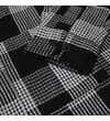 Thumbnail Close-up of buttoned cuff on black and white checked shirt.