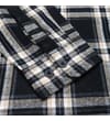 Thumbnail Close-up of buttoned cuff on black checked flannel shirt.