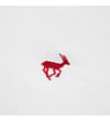 Thumbnail Close-up of red embroidered chest logo on white polo.