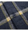 Thumbnail Close-up of the front button placket on the checked flannel shirt.