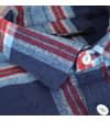 Thumbnail Close-up of blue plaid overshirt collar and top buttons.
