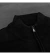 Thumbnail Close-up of the high ribbed collar on the knitted jumper.