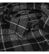 Thumbnail Close-up of the collar on the black and grey checked shirt.