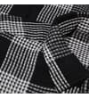 Thumbnail Close-up of black and white waffle check fabric texture.