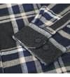 Thumbnail Close-up of buttoned cuff on charcoal plaid flannel overshirt.
