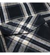 Thumbnail Close-up of chest pocket flap on checked flannel shirt.