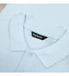 Thumbnail Close-up of the light blue polo collar and button placket.