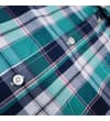 Thumbnail Macro view of buttons and check fabric on the shirt.