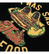 Thumbnail Angled close-up of the food slogan graphic on the black T-shirt.