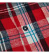 Thumbnail Close-up of button placket on red checked flannel shirt.