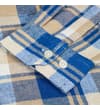 Thumbnail Close-up of the buttoned cuff on the checked flannel shirt.