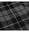 Thumbnail Close-up of the chest pocket on the checked flannel shirt.
