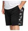 Thumbnail Model wearing black shorts with grey camo side panel.