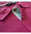 Thumbnail Close-up of mauve polo collar and contrast placket detail.