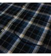 Thumbnail Close-up of button placket and chest pocket on check shirt.